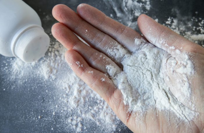 Talcum powder on hands