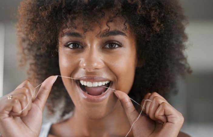 woman flossing